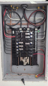 A newly installed electrical panel with organized wiring and circuit breakers by AnchorLine Electrical in Alaska, AK