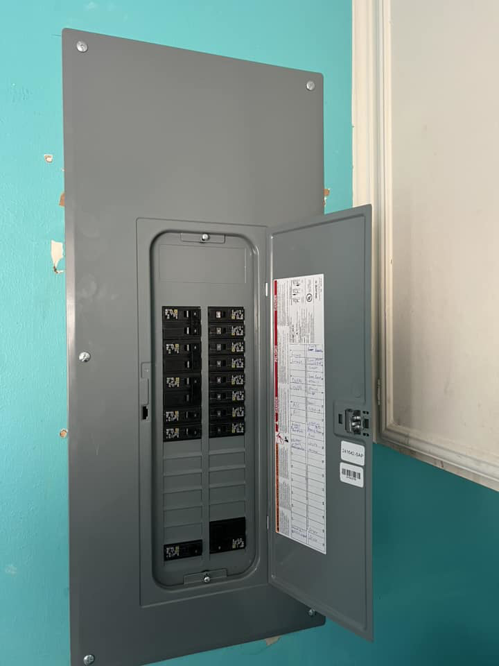 A newly installed electrical panel with breakers open for inspection by Ark Electrical Service in Tomball, TX
