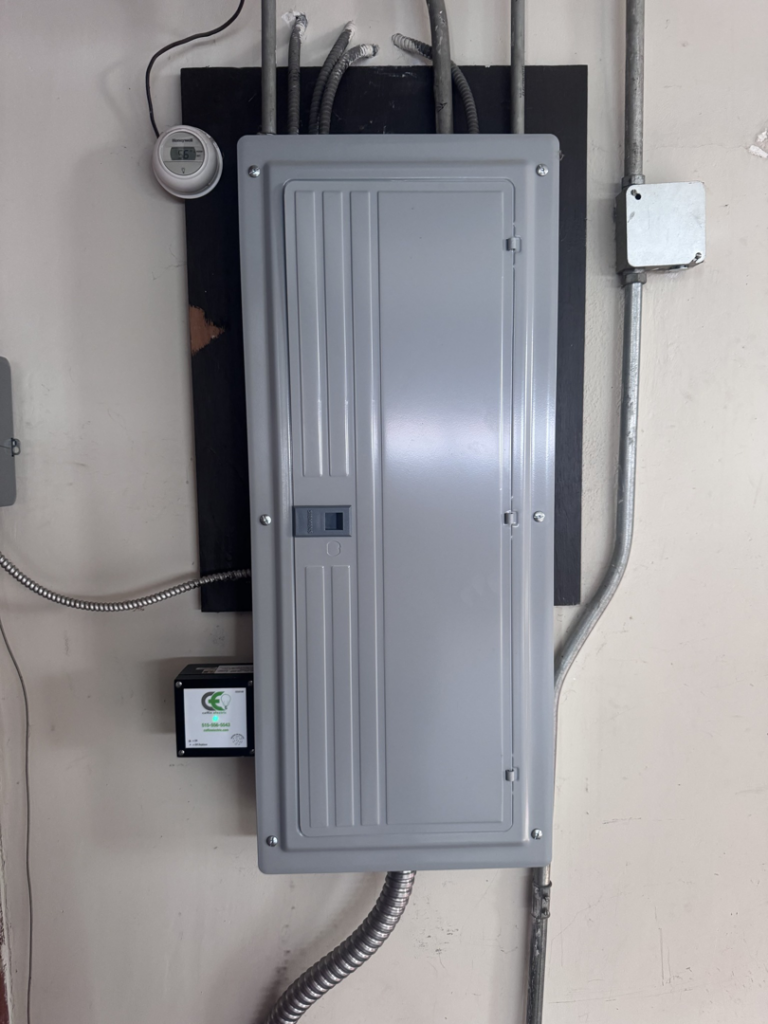 An installed electrical panel and conduit system by Coffin Electric in Grimes, IA.