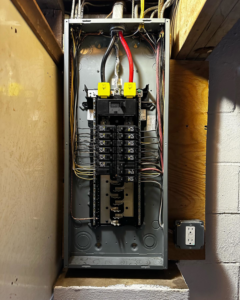 An electrical panel installation with wiring visible, performed by Elite Electric in Valley Falls, NY