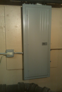 An electrical panel and conduit installed on a wall by Hunsicker Electrical Services in Chicago, IL.