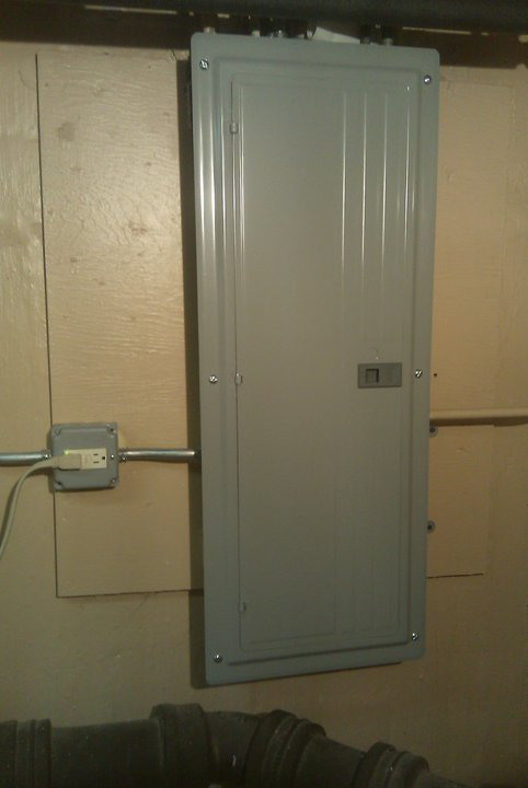 An electrical panel and conduit installed on a wall by Hunsicker Electrical Services in Chicago, IL.