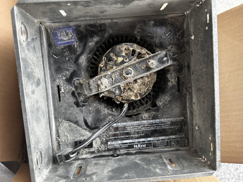 An electrical panel with wiring and an 'Approval for Electrical' sticker, indicating installation or inspection by Conductive Electrical Contracting in Smyrna, DE.