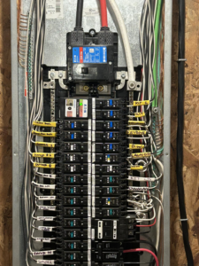 A newly installed and labeled electrical panel by KG Electric LLC in Cumberland, RI