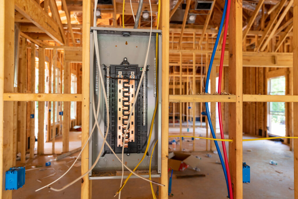 An electrical panel being installed in a new construction home, showing wiring by Gen Pump & Power in Aurora, IL.