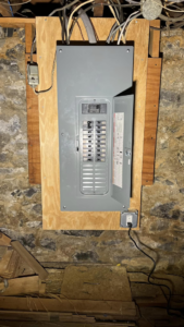 An electrical panel installation with an open breaker box showing circuits by Rossetti Electric in Bethlehem, PA