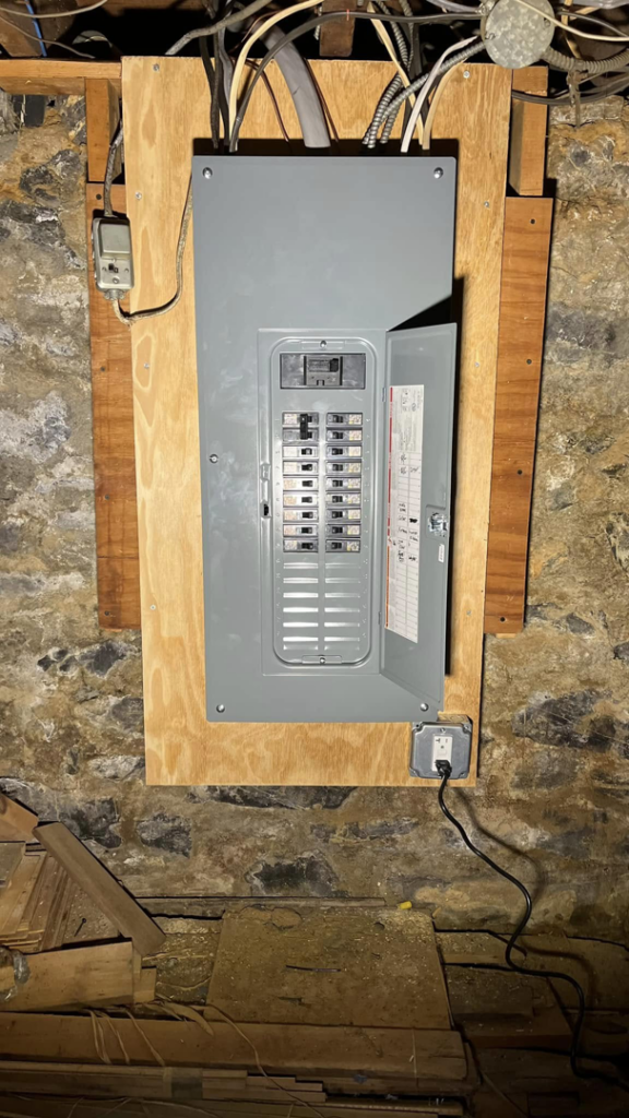 An electrical panel installation with an open breaker box showing circuits by Rossetti Electric in Bethlehem, PA