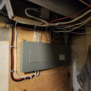 A newly installed electrical panel with organized wiring and conduits by SEL Electric in Truro, NS.