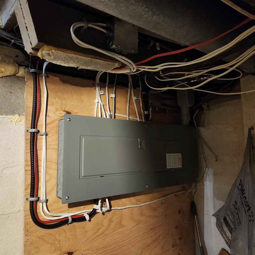 A newly installed electrical panel with organized wiring and conduits by SEL Electric in Truro, NS.