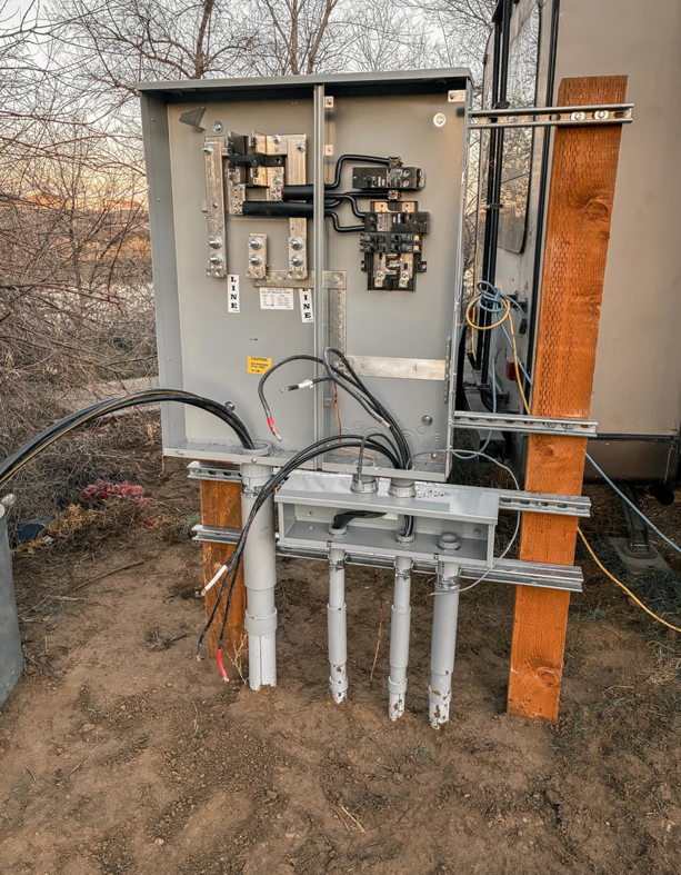 An open electrical panel with conduits and wiring being installed by Tier 1 Electric in Boise, ID.