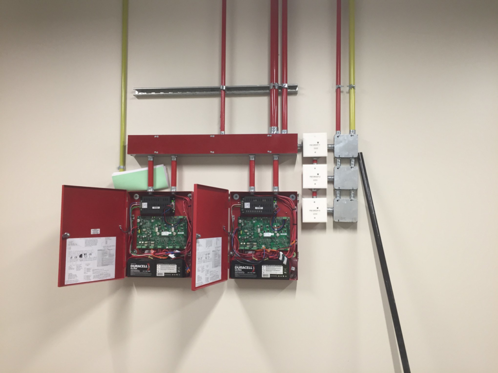 Electrical panel installation with exposed wiring and conduits, expertly handled by Grason Electric in Fort Collins, CO.