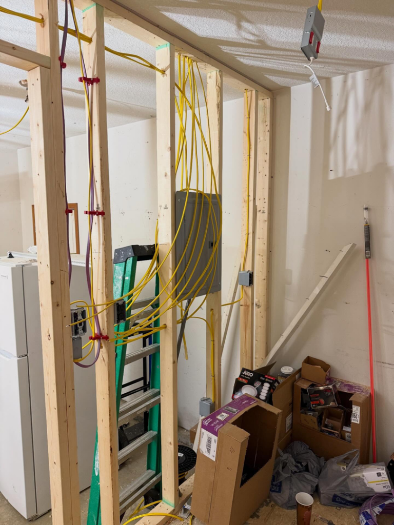 Electrical panel installation with extensive wiring during a rough-in by J's Electrical & Maintenance Services, LLC in Columbus, OH.