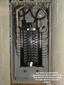 A newly installed electrical panel with neatly organized wiring and circuit breakers by York Electrical Services in York, PA.