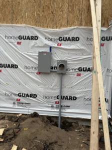 An electrical panel and meter base installed on the exterior of a new construction home by JayCo Lighting & Electric in Colorado Springs, CO.