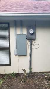 Outdoor electrical panel and meter installation on the side of a house by Vazquez Electrical Contractor LLC in Dallas, TX