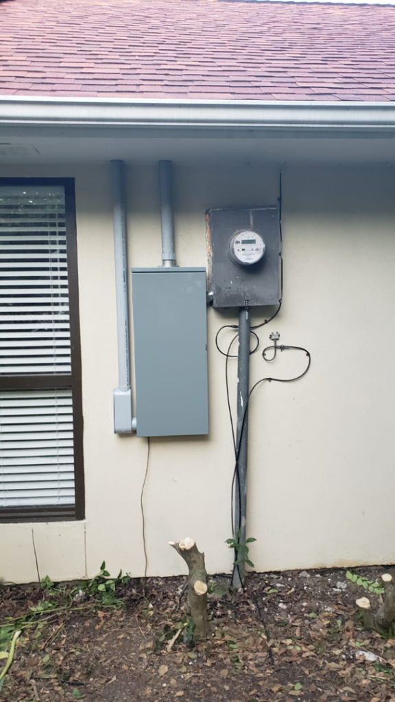 Outdoor electrical panel and meter installation on the side of a house by Vazquez Electrical Contractor LLC in Dallas, TX