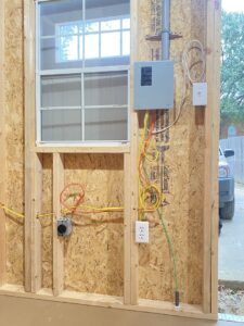 Electrical panel, outlet, and wiring installation in a shed by Ross Electric Company in Arlington, TN.