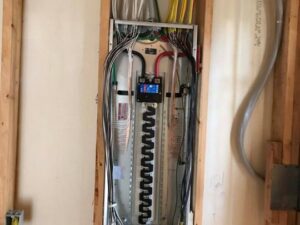 An electrical panel with extensive rough-in wiring during installation by Decatur Electrician Now in Decatur, AL.