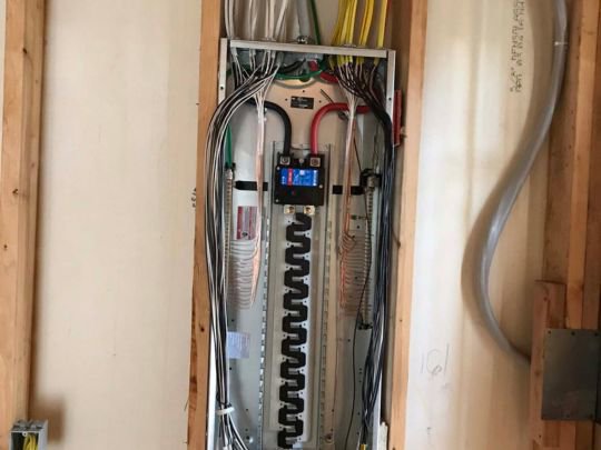An electrical panel with extensive rough-in wiring during installation by Decatur Electrician Now in Decatur, AL.
