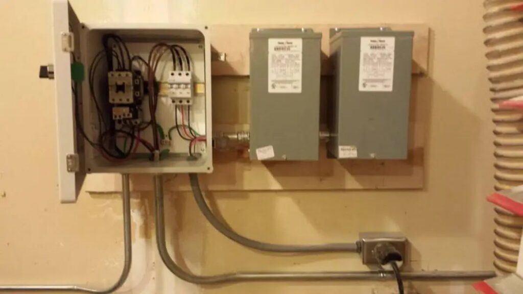 Electrical panel and transformers mounted on a wall, expertly installed by BlackRock Electrical in Pocatello, ID.