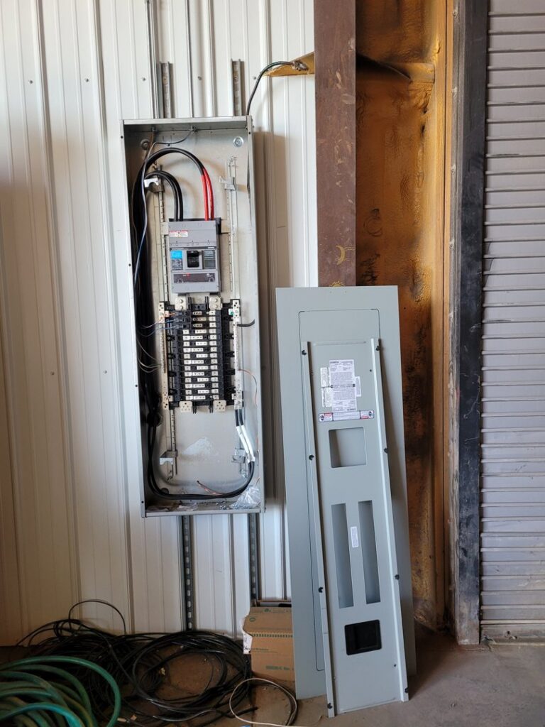 An open electrical panel showing an upgrade or new installation by FOXX & Hounds Electric in Sioux City, IA.