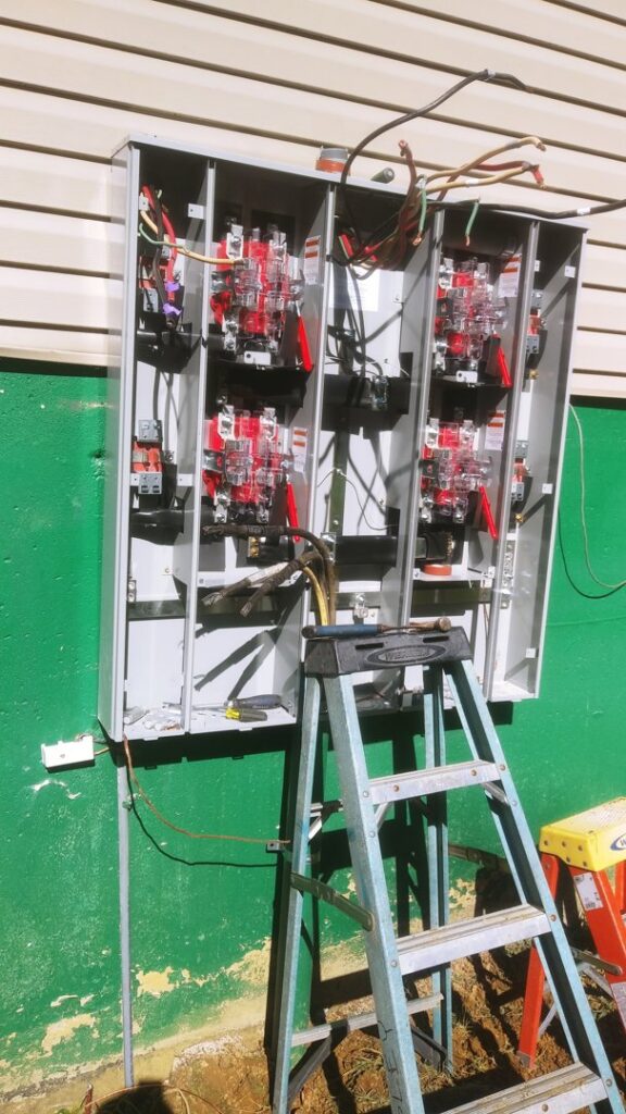 An open electrical panel showing wiring and circuit breakers during an upgrade or installation by TCB Electric LLC in Elizabethtown, KY.