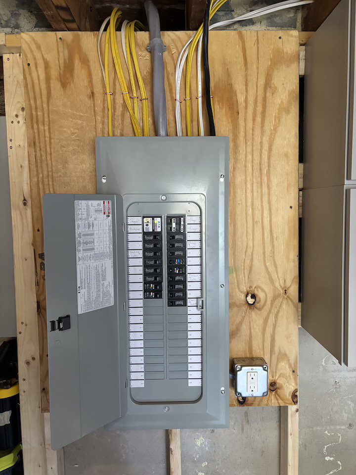An electrical panel upgrade showing circuit breakers by Kevin Kelley Electrical Inc in Leominster, MA.