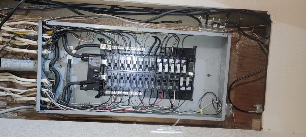An open electrical panel with circuit breakers and wiring, showcasing professional electrical service by PowerOn Electric llc in Solon, OH.