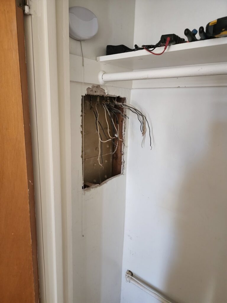 An open electrical panel box with wires exposed during an upgrade or repair by CDB Electrical LLC in Tucson, AZ.