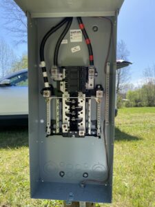 Detailed view of electrical panel wiring and circuit breakers by CM Electrical Solutions in Elizabethtown, KY.