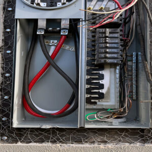 An open electrical panel showing wiring and circuit breakers, indicating an electrician job by Fuse Service HVAC & Electrical Sacramento, CA