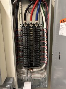 A professionally wired electrical panel and breaker box by GBE. Lectrical LLC in Gaithersburg, MD