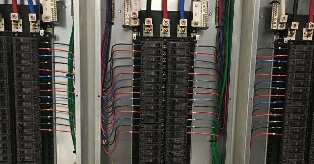A close-up view of a neatly wired electrical panel with circuit breakers by GJ Electric in Salina, KS.