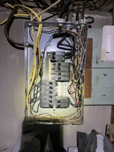 An open electrical panel showing wiring and circuit breakers, demonstrating work by Innovate Electric in Earth City, MO.