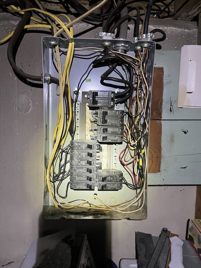 An open electrical panel showing wiring and circuit breakers, demonstrating work by Innovate Electric in Earth City, MO.