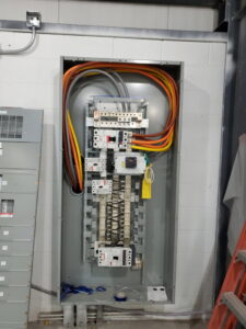 Detailed view of an electrical panel with heavy-gauge wiring and circuit breakers installed by Bottom To The Top Electric LLC in Lakewood, CO.