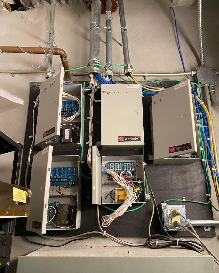 Detailed view of electrical panel wiring and conduit installation by Canseco Electrical Contractors, Inc. in Miami, FL.