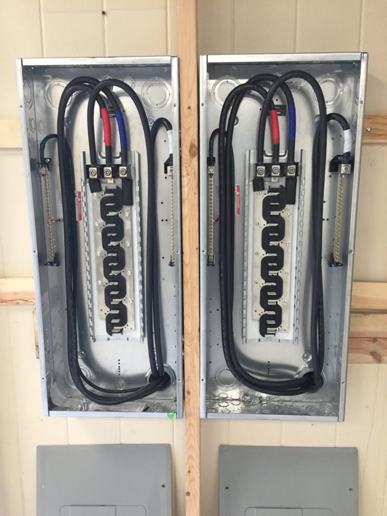 Two electrical panels with busbars and wiring installed by Electric Today in Indianapolis, IN.