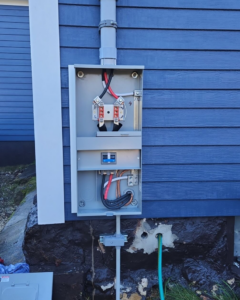 Close-up of an open electrical panel with wiring and circuit breaker installed by Flex Electric LLC in Boston, MA