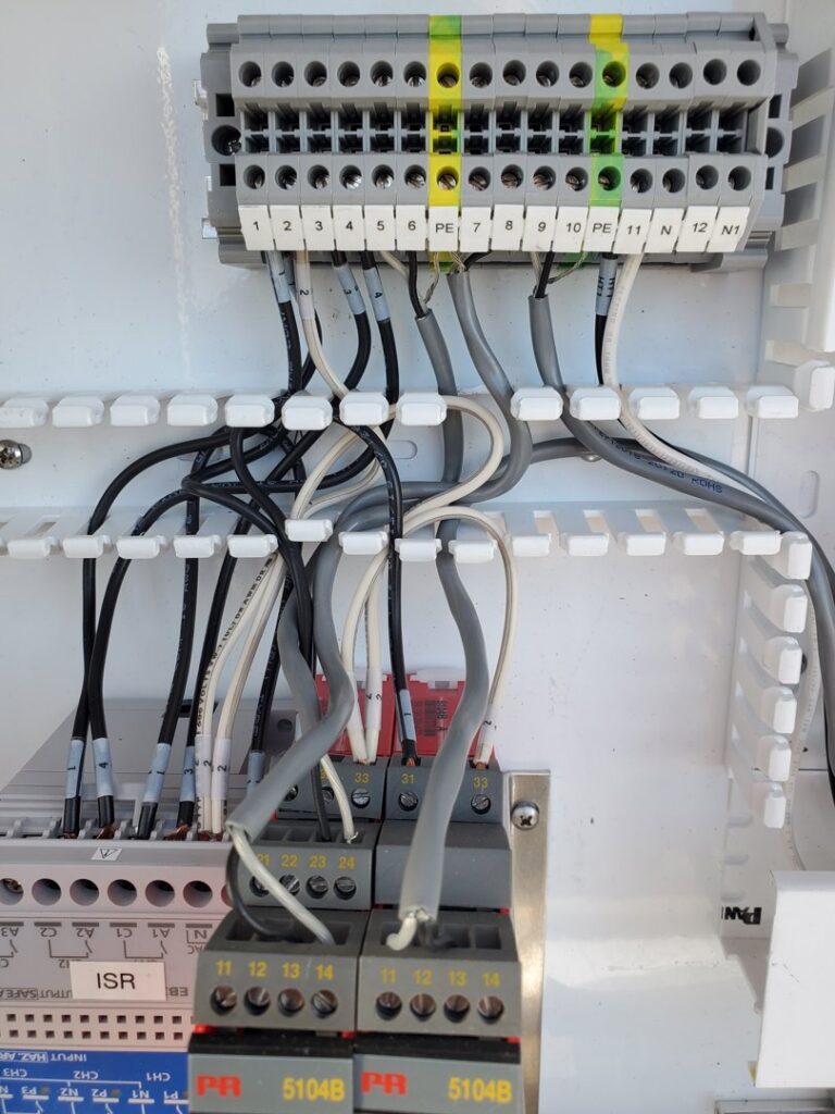 A close-up view of an electrical panel with neatly organized wiring, installed by Johnsen Electric Inc in Springfield, OR.