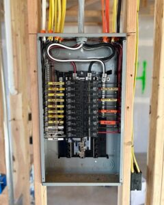 An electrical panel with neatly organized wiring and labeled circuits installed by Next Level Pros in Lakewood, CO.