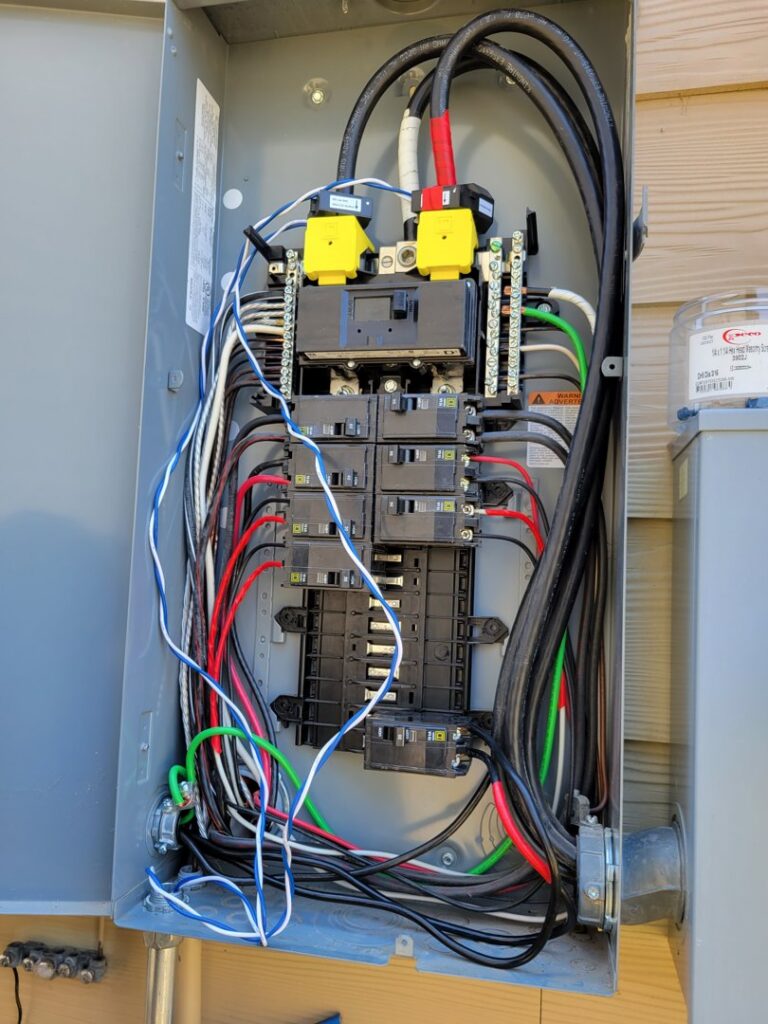 Open electrical panel with organized wiring and circuit breakers, installed by Omni Power Electrical Services LLC in San Antonio, TX