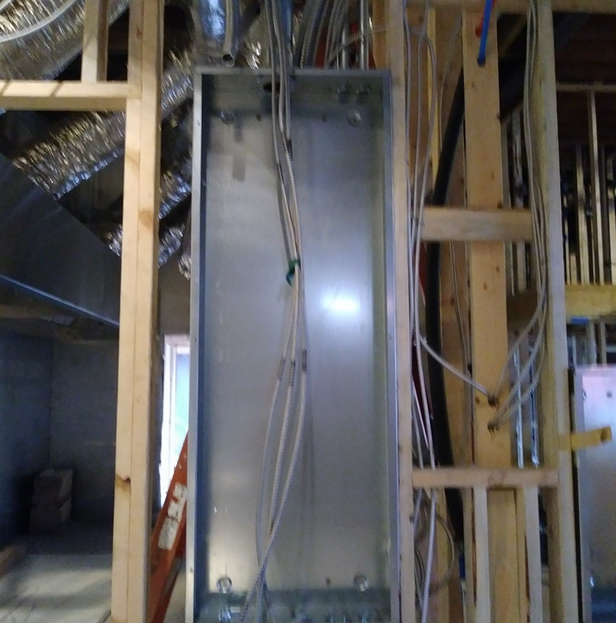 An electrical panel box with wiring being installed during a new construction project by Sitara Electric in Knoxville, TN.