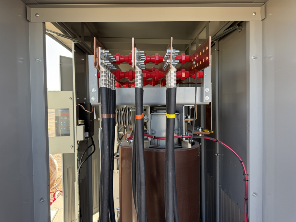 An open electrical panel showing heavy-duty wiring and busbar connections, demonstrating electrician work by WES in Houston, TX.