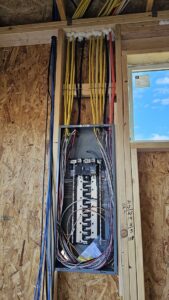 An electrical panel with wiring installed in a new construction project by V Electrical LLC in Albuquerque, NM.