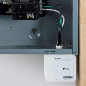 Close-up of an electrical panel with wiring and a whole home surge protector installed by Mayflower Electric LLC in Knoxville, TN