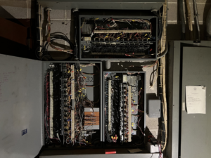 Detailed view of complex electrical panel wiring and components by TJAM Electric in Springtown, TX.
