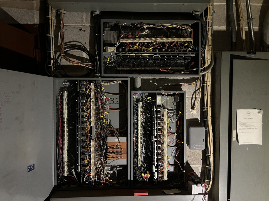 Detailed view of complex electrical panel wiring and components by TJAM Electric in Springtown, TX.