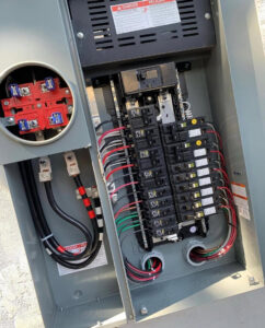 An open electrical panel showing new wiring and circuit breakers, installed by Vitality Electric in Sacramento, CA.