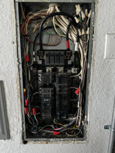 An open electrical panel showing complex wiring and circuit breakers, expertly installed by Volt-Pro Electric, LLC in Houston, TX